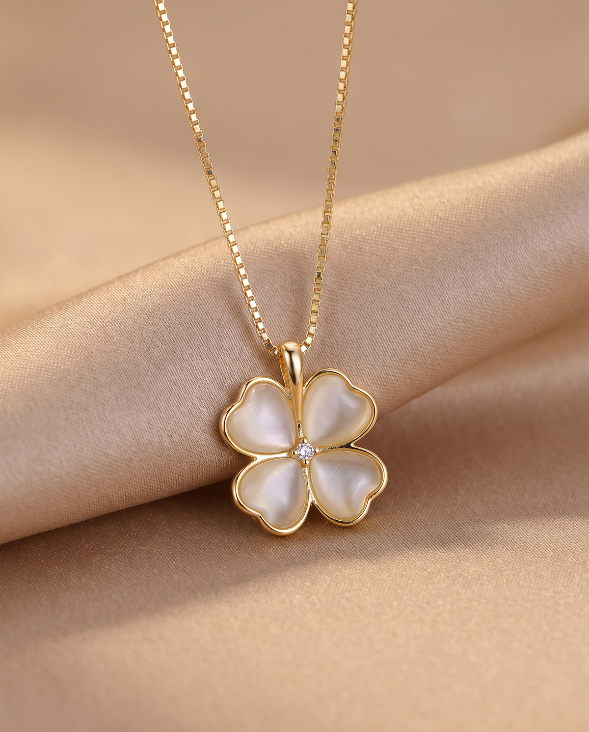 Heart Clover Pendant Necklace in gold-tone on beige silk