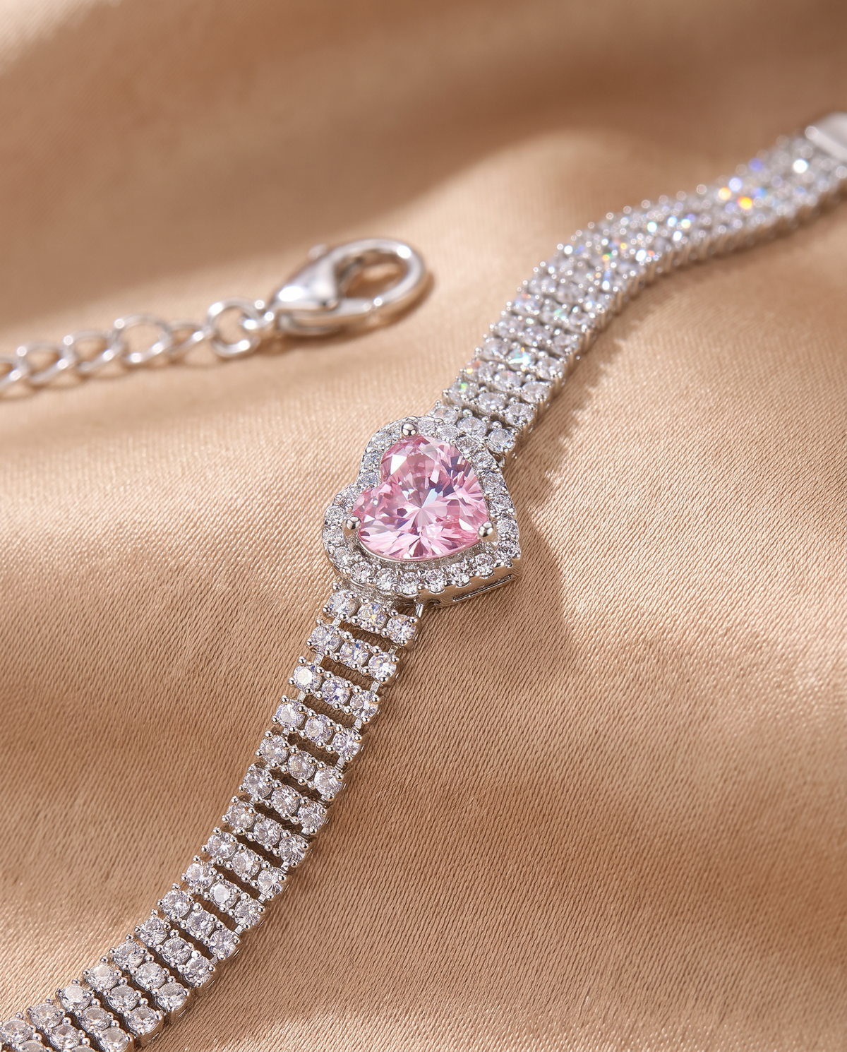 Close-up of the pink heart cubic zirconia with clear stone halo