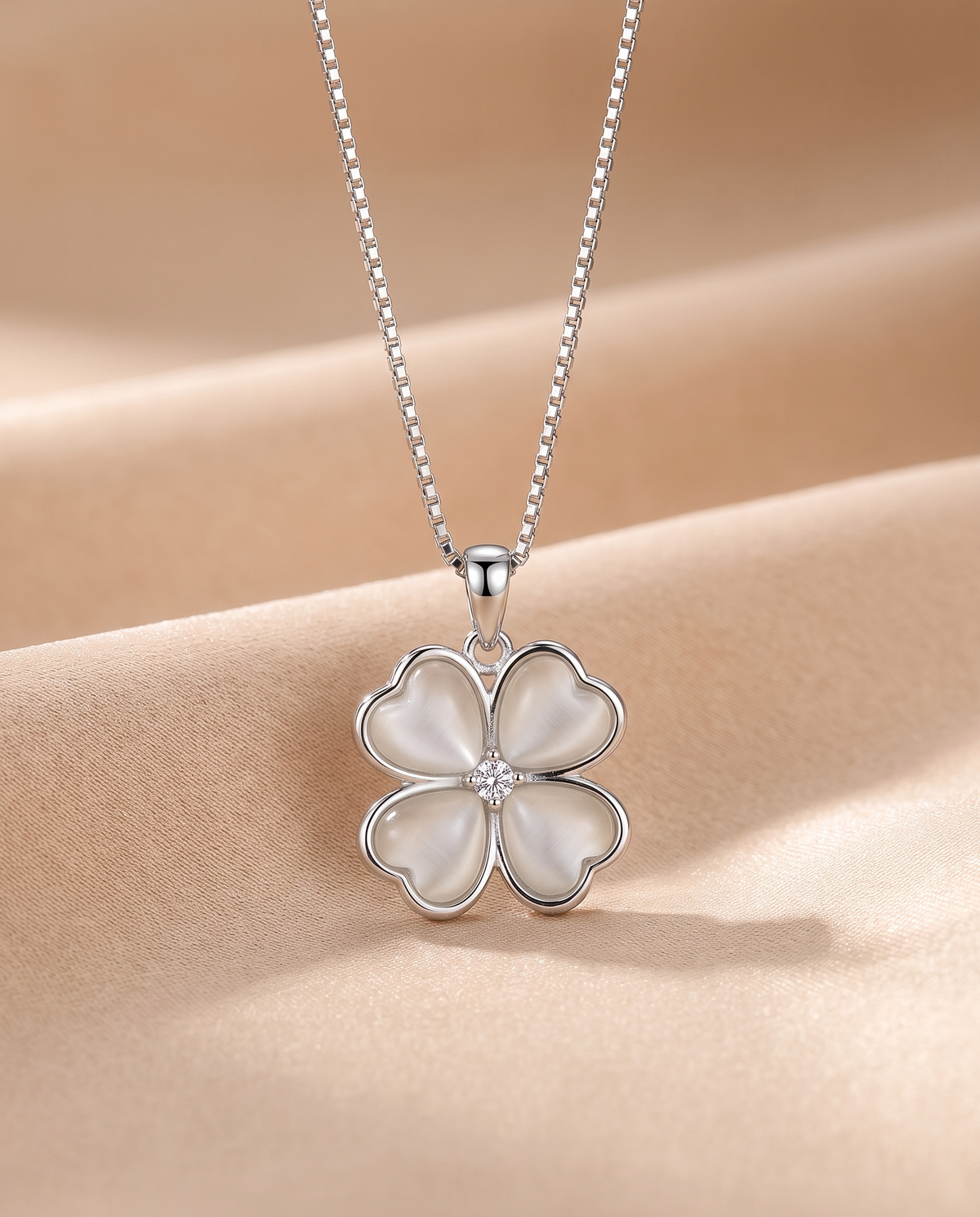 Heart Clover Pendant Necklace in silver on beige silk